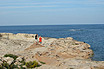 Tourists On The Rocky Coast Ibiza